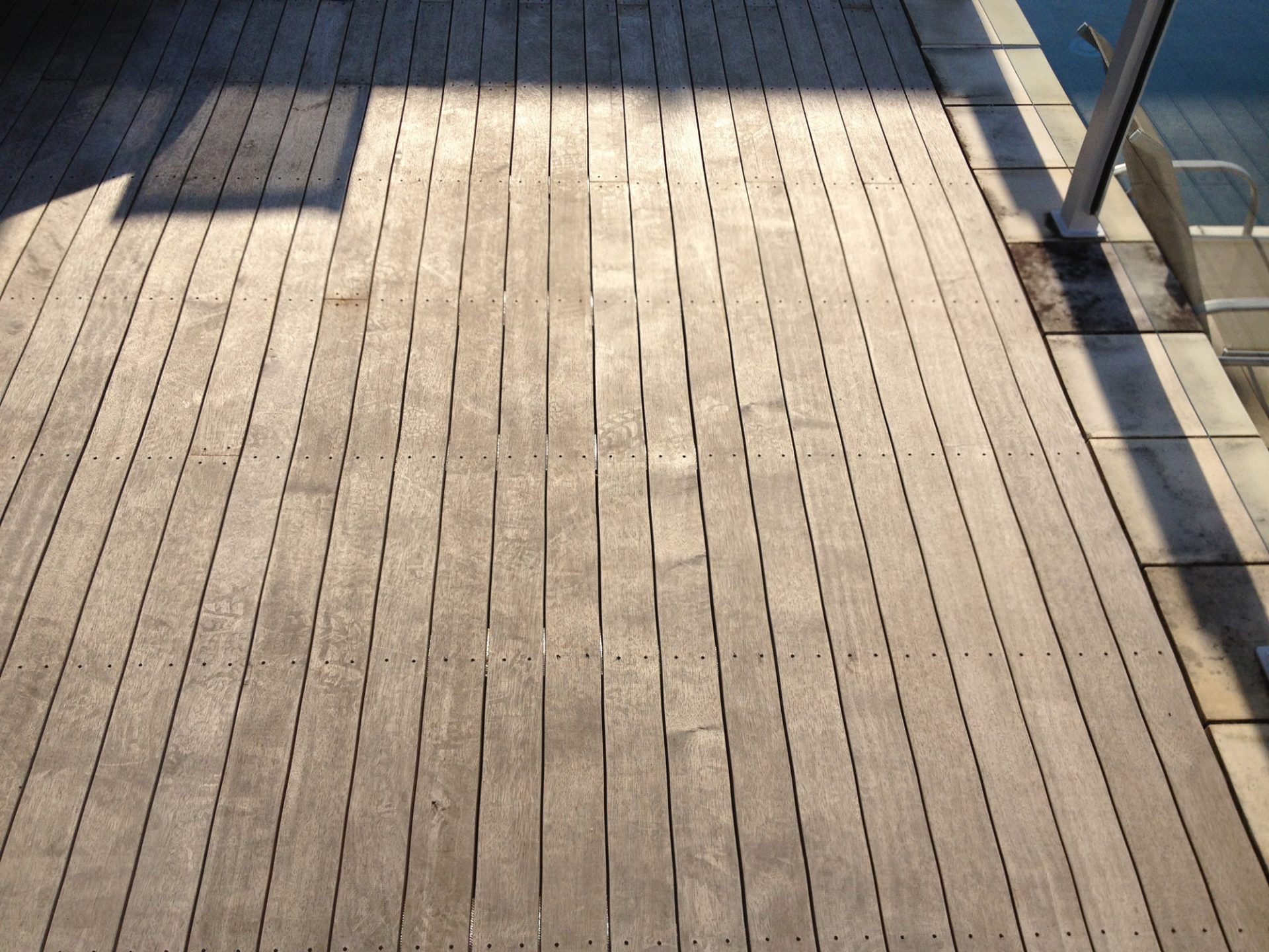 Clean light timber deck with the morning sun on it
