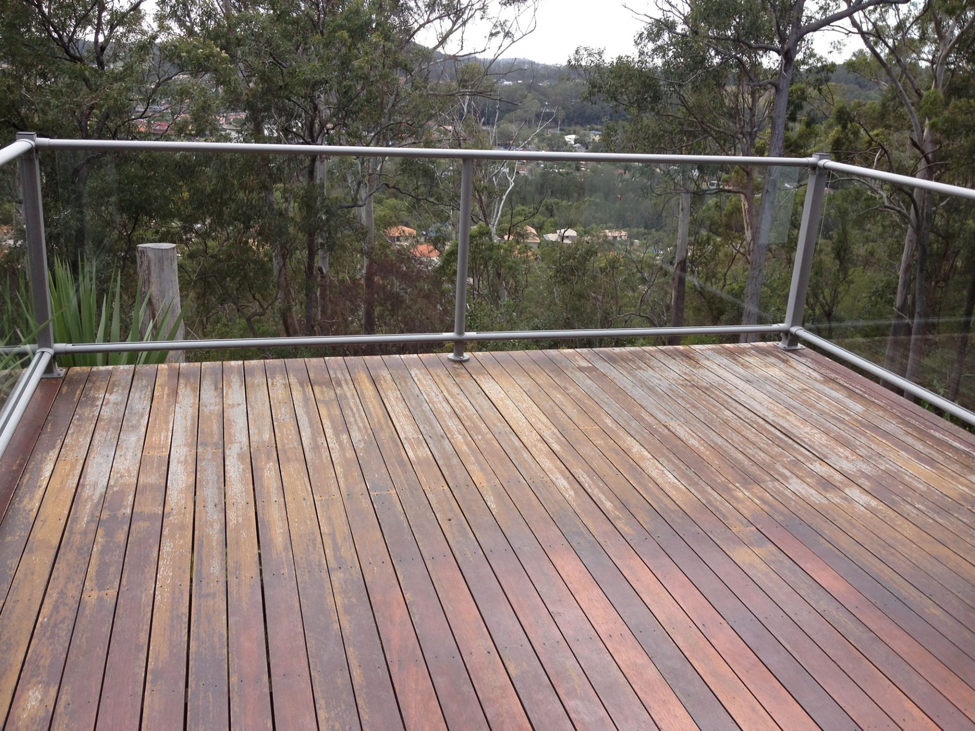 Dark timber deck with weather damage